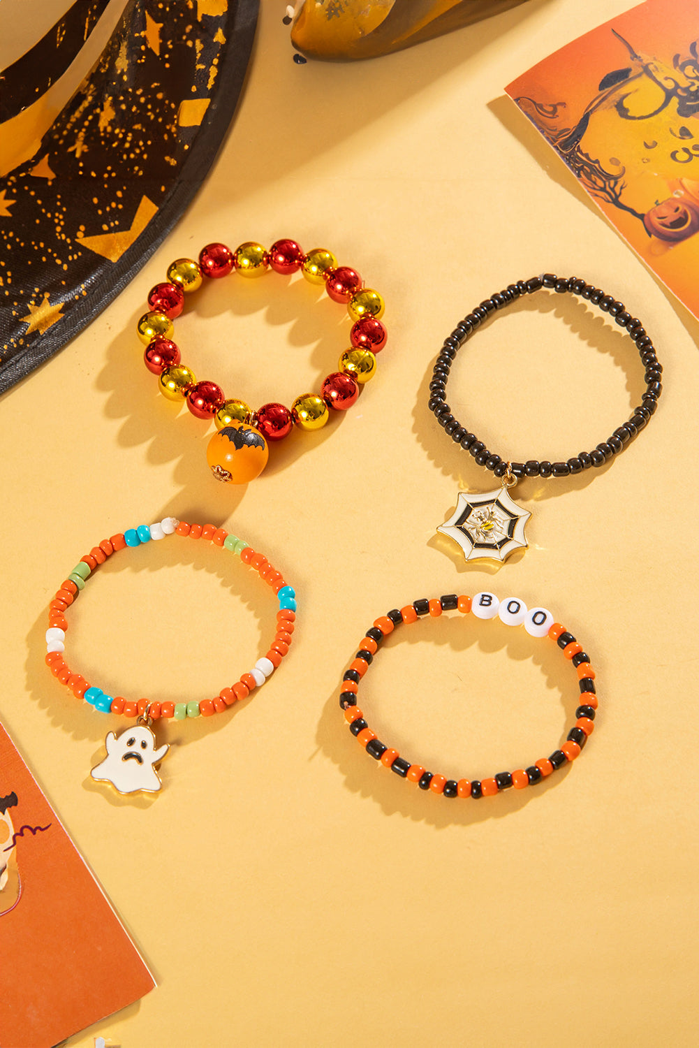 Juego de 4 pulseras de cuentas con telaraña fantasma de Halloween de color naranja