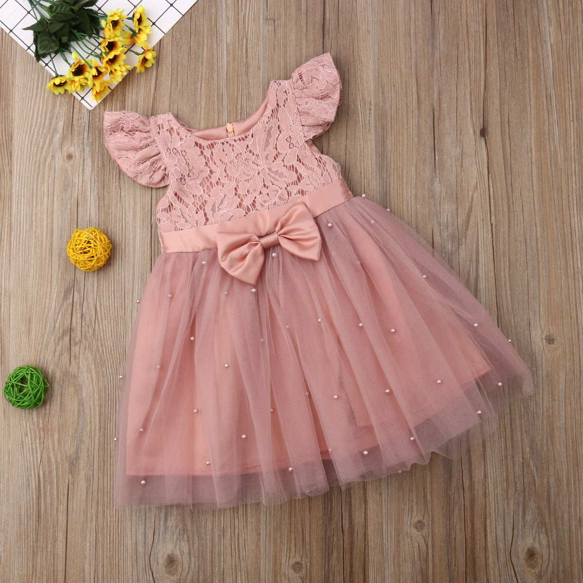 Süßes rosa Perlen Babykleid