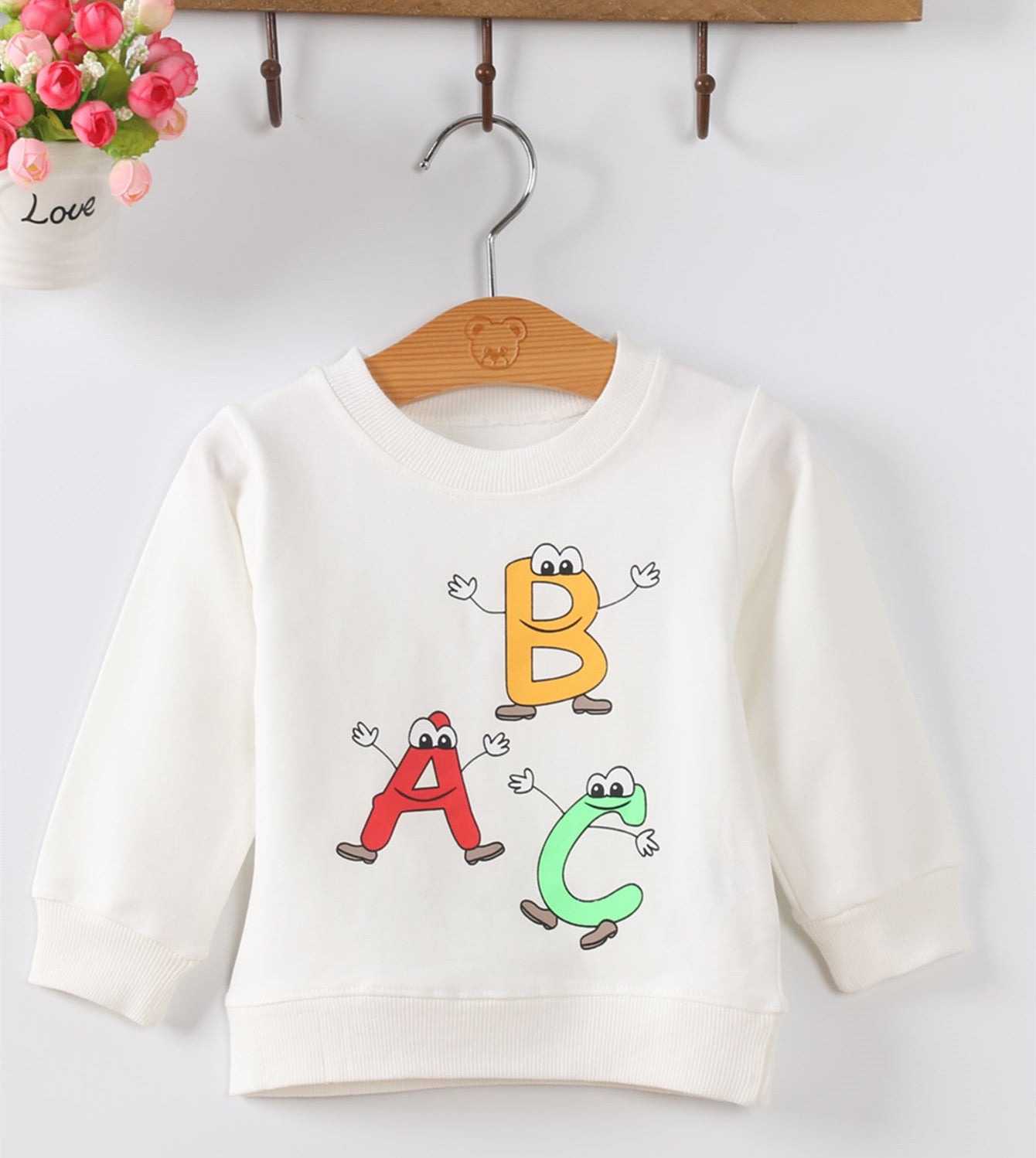 Weibliche Pullover Babykleidung